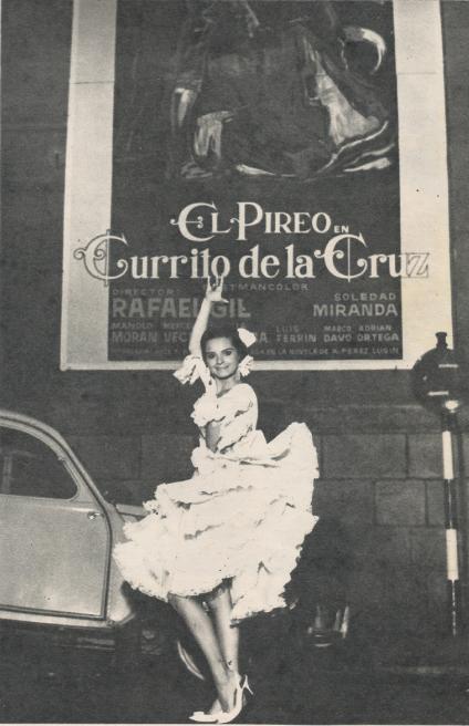 18still1.jpg - Soledad posing in front of a Currito de la Cruz poster